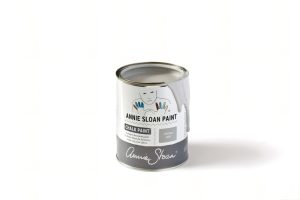 A tin of Annie Sloan Chalk Paint in a light grey colour
