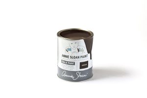 An open tin of dark brown Annie Sloan Chalk Paint