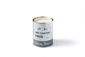 A tin of Annie Sloan Chalk Paint in a warm, creamy white