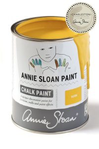 An open tin of Annie Sloan Chalk Paint in a rich yellow colour