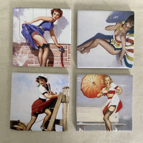 A set of 4 coasters each depicting a 50s retro girl in different colours and poses
