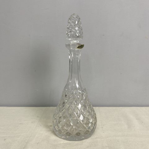 A vintage cut glass decanter with stopper with sticker stating "Violetta - made in Poland"