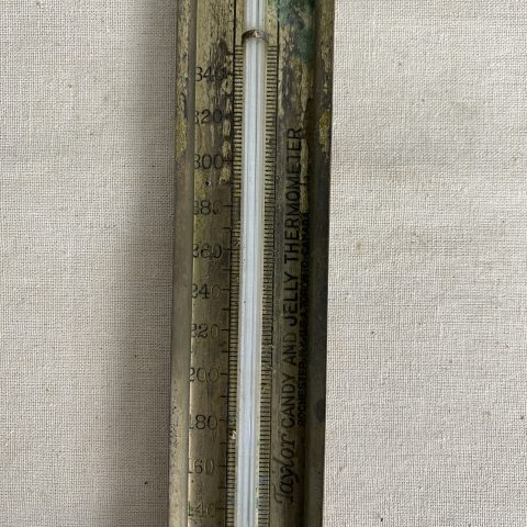 A vintage kitchen thermometer