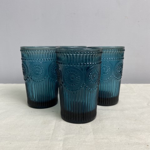 A set of 4 blue textured tall glass tumblers in a vintage style