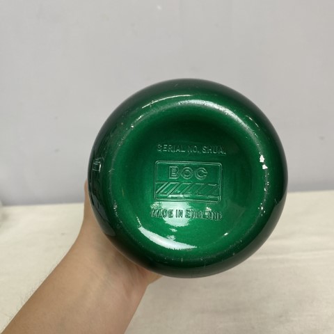 A vintage green anodised soda syphon