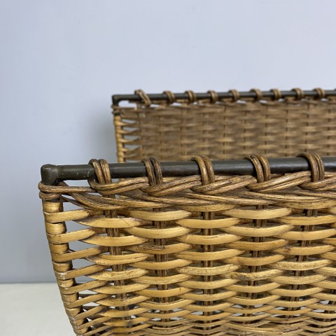 A metal and woven cane folding magazine rack