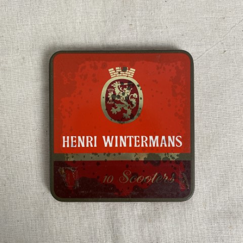 A vintage flat, square tobacco tin for Henri Winterman's 'Scooters'