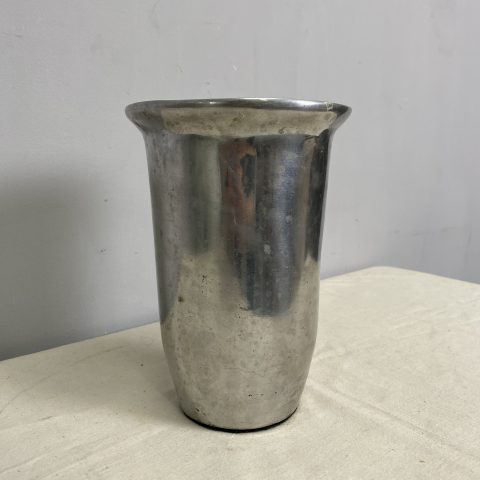 A silver coloured metal wine cooler