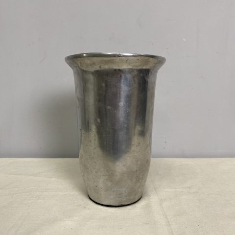 A silver coloured metal wine cooler