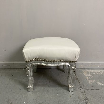 French Style Footstool with Silver Leaf Finish and white vinyl upholstery