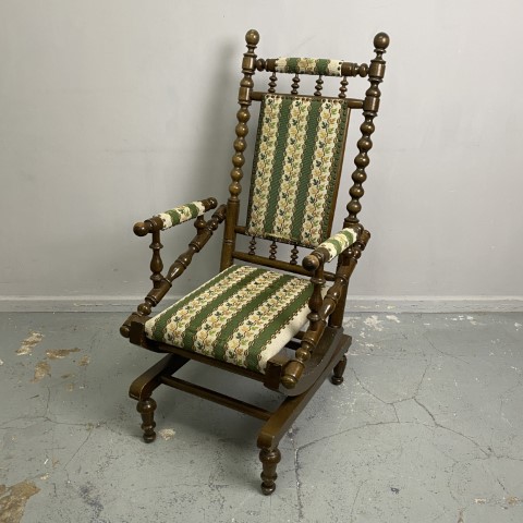 Vintage Dexter Rocking Chair - green upholstery with leaf pattern