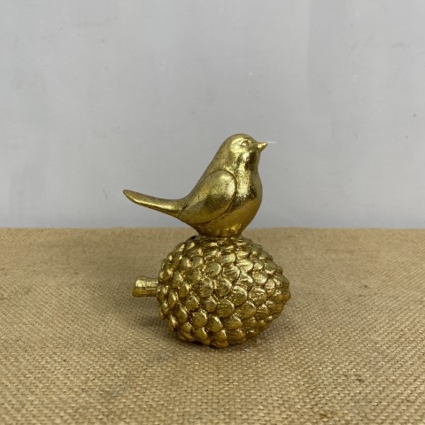 Golden Bird on Pine Cone