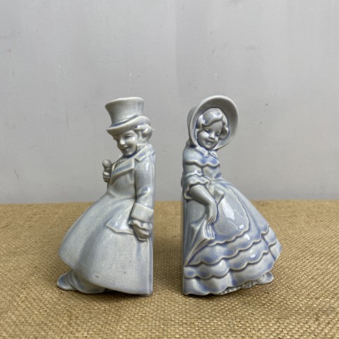 Vintage Blue Ceramic Bookends - victorian man and woman sitting back to back